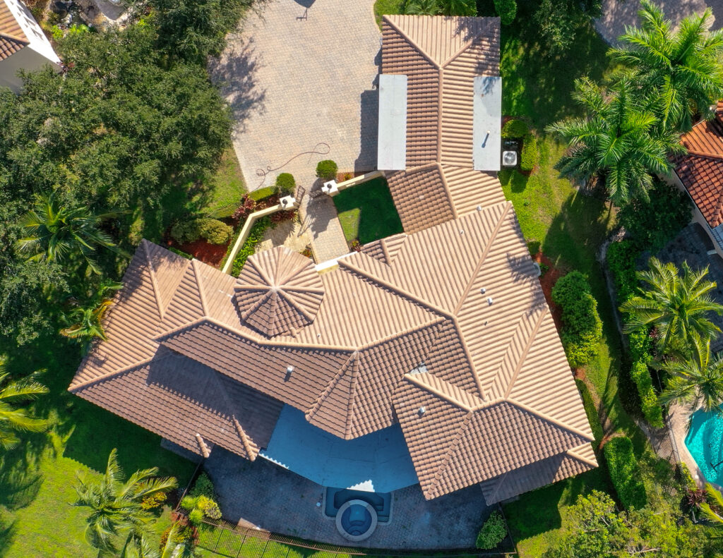 large home with recent tile roofing job by bravo's roofing